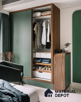 Modern bedroom with sage green and walnut wood wardrobe, white laminate drawers, and glossy tile flooring | Material Depot