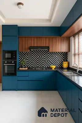 Modern Blue Modular Kitchen with Bold Black-and-White Geometric Backsplash, Walnut Overhead Cabinets & Black Granite Countertop in Prestige Royal Garden Doddaballapur | Material Depot