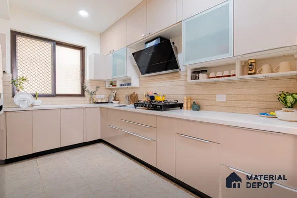 Modern dual tone kitchen with beige and frosty white laminate, white quartz countertop, and travertine look backsplash tile in Bengaluru | Material Depot