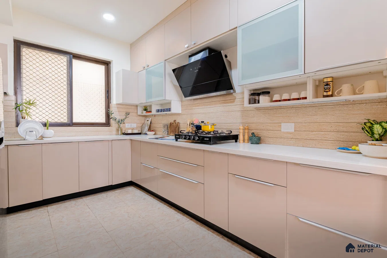 Modern dual tone kitchen with beige and frosty white laminate, white quartz countertop, and travertine look backsplash tile in Bengaluru | Material Depot