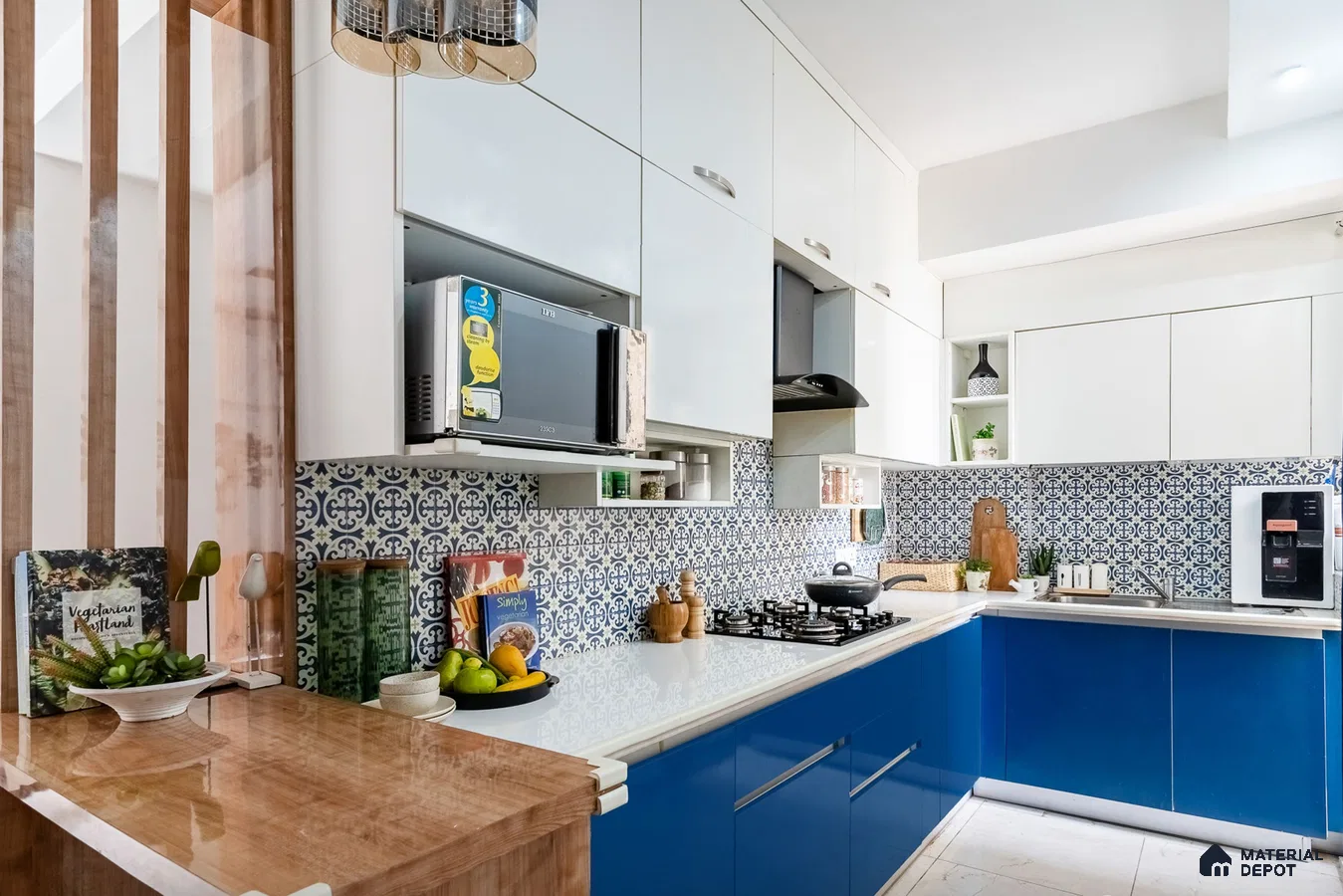 Modern dual tone kitchen with blue and white laminate, white quartz countertop, and blue patterned backsplash tiles in Bengaluru | Material Depot
