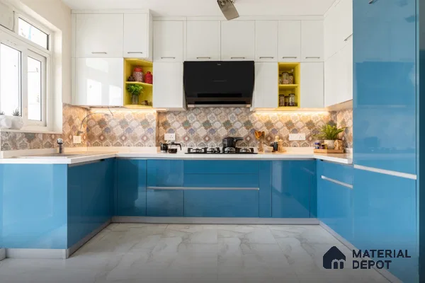 Modern dual tone kitchen with blue high gloss laminate, white laminate, patterned backsplash tile, and white marble floor tile in Bengaluru | Material Depot