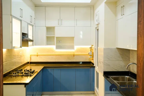 Modern dual tone kitchen with frosty white high gloss laminate, blue matte laminate, and marble look backsplash in Bengaluru | Material Depot