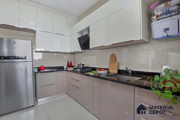 Modern dual tone kitchen with glossy beige and white laminate cabinets and black granite countertop in Bengaluru | Material Depot