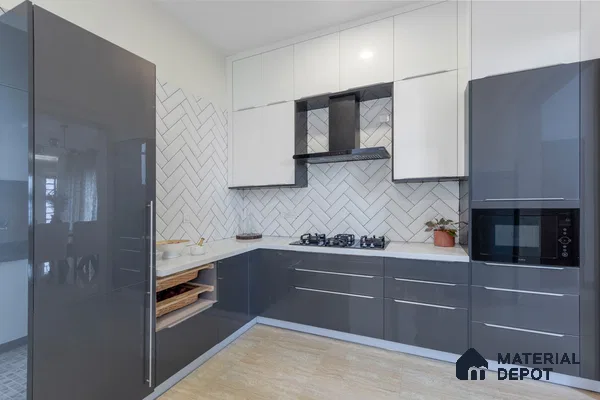 Modern dual tone kitchen with glossy grey and white laminate, white quartz countertop, and herringbone subway backsplash tile in Bengaluru | Material Depot