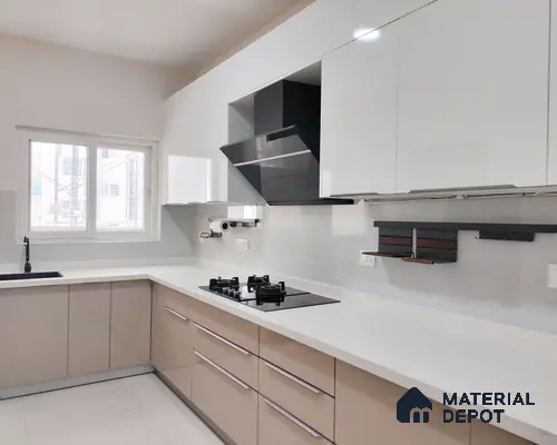 Modern dual tone kitchen with glossy white and beige laminate cabinets and white quartz countertop in Bengaluru | Material Depot