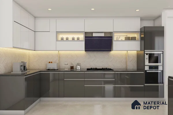 Modern dual tone kitchen with glossy white and grey laminate, chevron beige backsplash tile, and black quartz countertop in Bengaluru | Material Depot