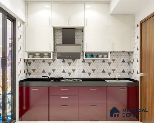 Modern dual tone kitchen with glossy white and wine red laminate, geometric triangle backsplash tiles, and black granite countertop in Bengaluru | Material Depot