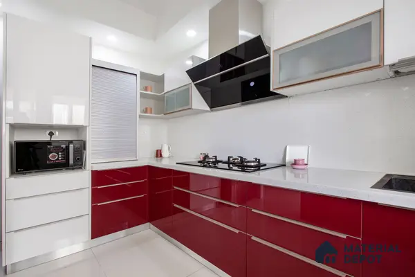 Modern dual tone kitchen with high gloss burgundy and white laminate, white quartz countertop, and white speckled backsplash in Bengaluru | Material Depot