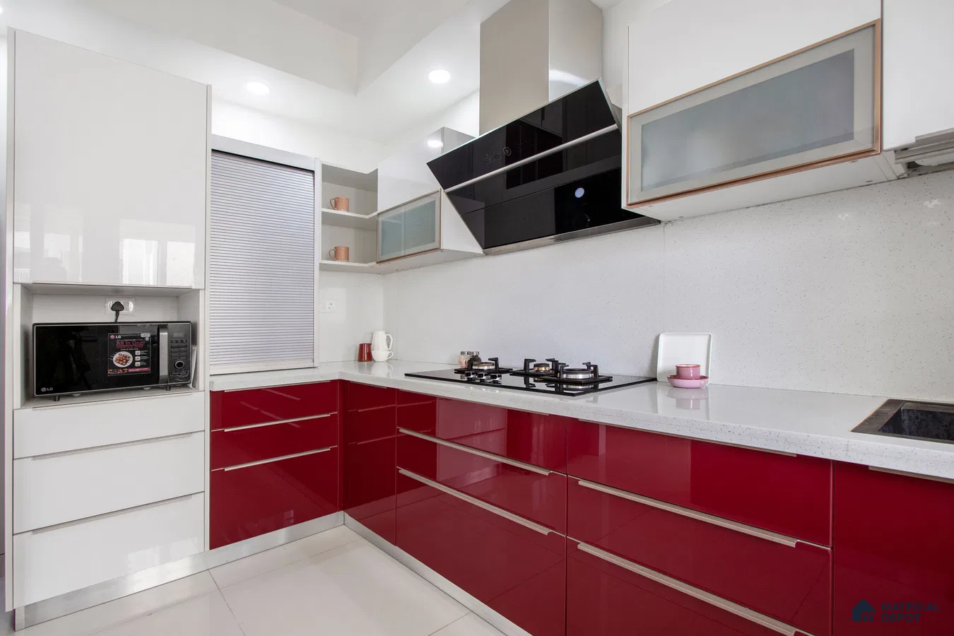 Modern dual tone kitchen with high gloss burgundy and white laminate, white quartz countertop, and white speckled backsplash in Bengaluru | Material Depot