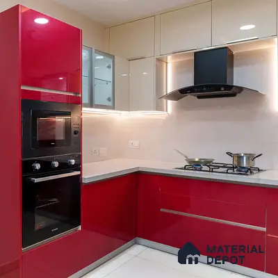 Modern dual tone kitchen with high gloss red and beige laminate, white quartz countertop, and built-in appliances in Bengaluru | Material Depot