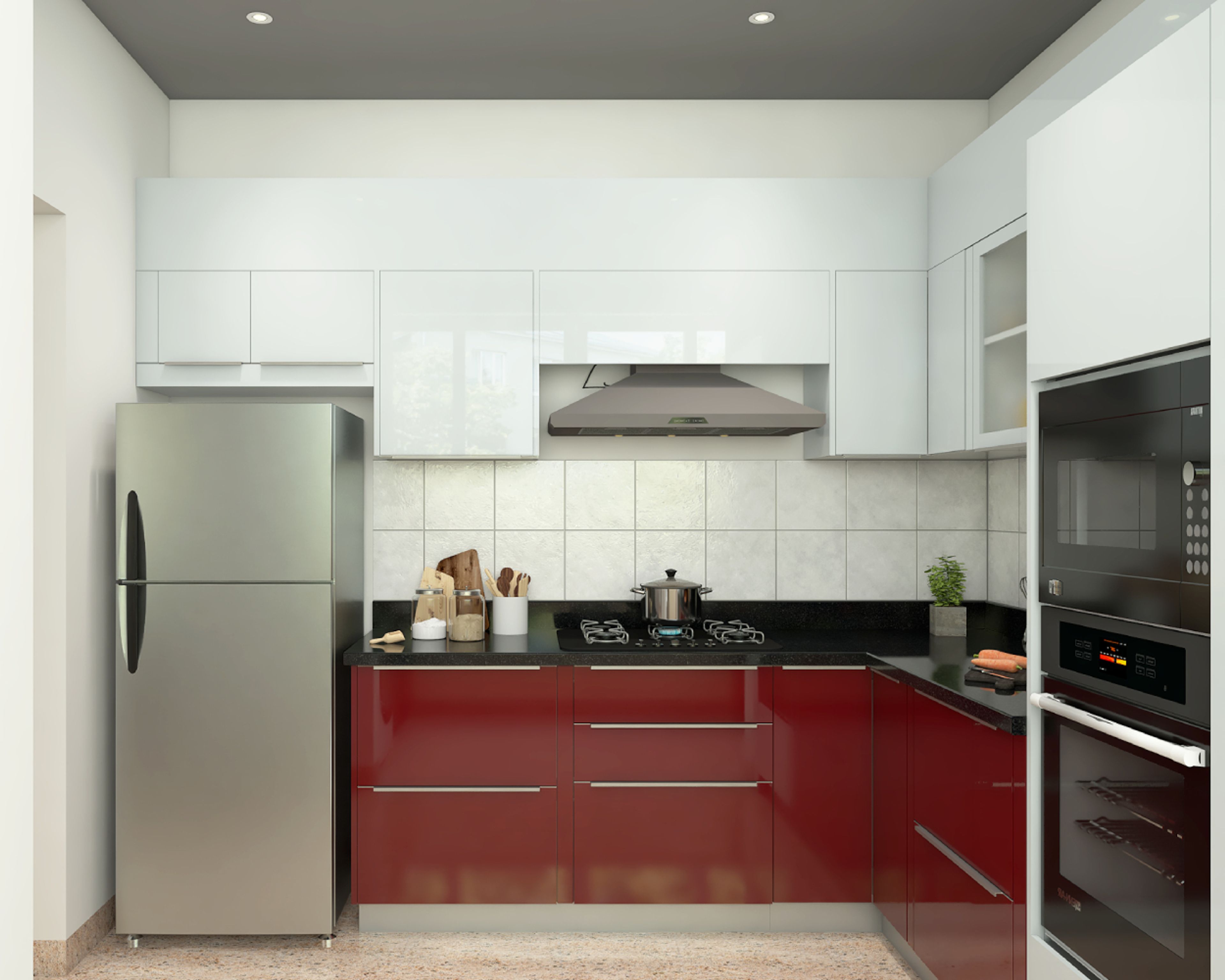 Modern dual tone kitchen with high gloss white and wine red laminate, black granite countertop, and white ceramic wall tiles in Bengaluru | Material Depot