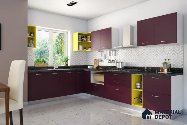 Modern dual tone kitchen with maroon and yellow laminate cabinets, black granite countertop, and geometric patterned backsplash tiles in Bengaluru | Material Depot