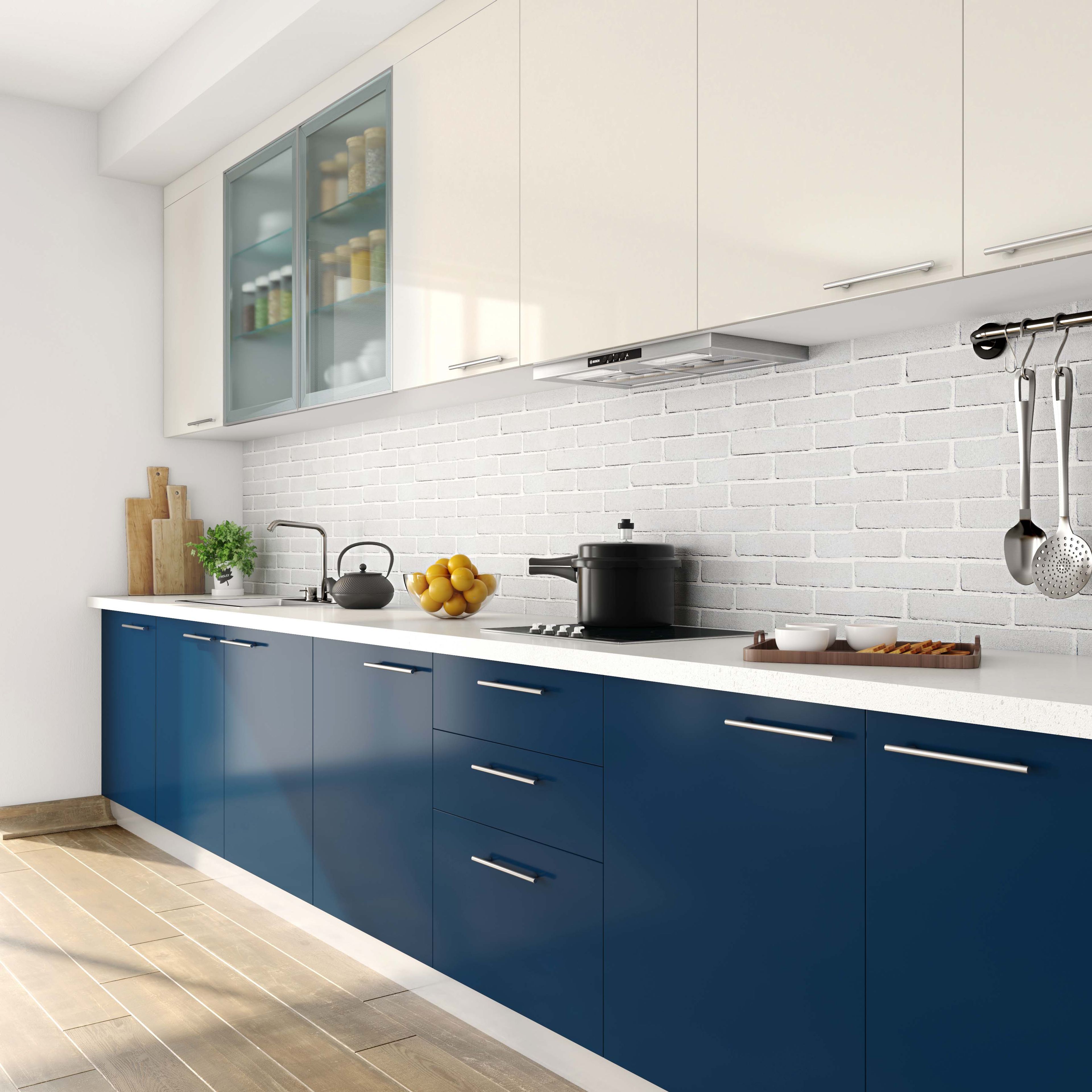 Modern dual tone kitchen with navy blue and frosty white laminate, white quartz countertop, and white brick backsplash tile in Bengaluru | Material Depot