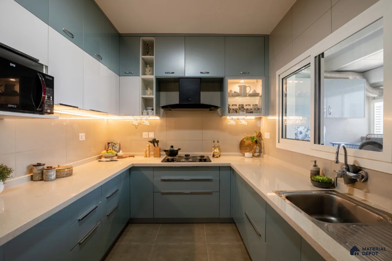 Modern dual tone kitchen with pastel blue and frosty white laminate, quartz countertop, and beige wall tiles in Bengaluru | Material Depot