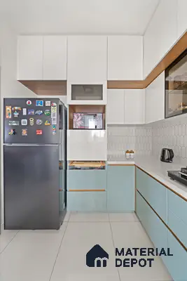 Modern dual tone kitchen with pastel blue and frosty white laminate, white quartz countertop, and white geometric backsplash tile of 2 BHK in Purva Palm Beach Hennur Bengaluru | Material Depot