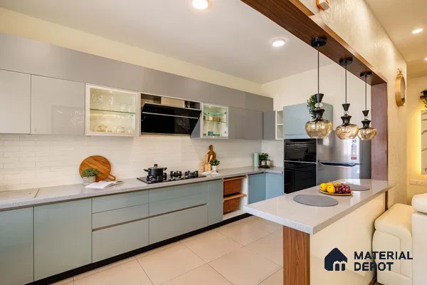 Modern dual tone kitchen with pastel blue and grey laminate, white quartz countertop, and white brick subway tile backsplash in Bengaluru | Material Depot