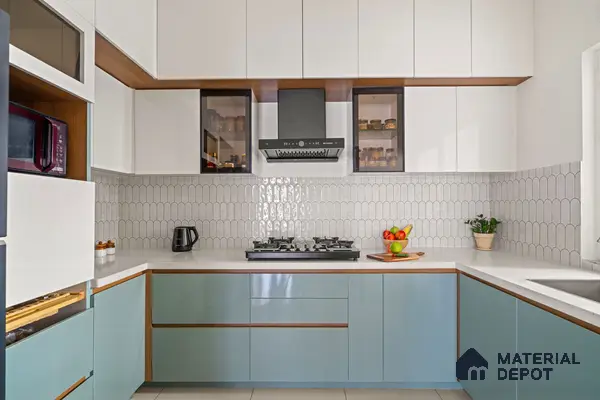 Modern dual tone kitchen with pastel blue laminate, frosty white laminate, and scallop white backsplash tile of 2 BHK in Purva Palm Beach Hennur Bengaluru | Material Depot