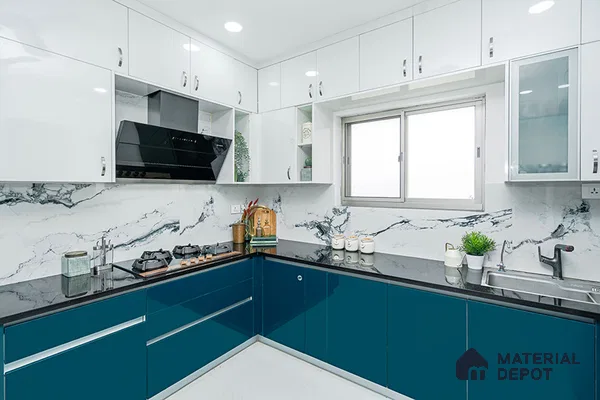 Modern dual tone kitchen with teal blue and frosty white high gloss laminate, marble-look backsplash tile, and black granite countertop in Bengaluru | Material Depot