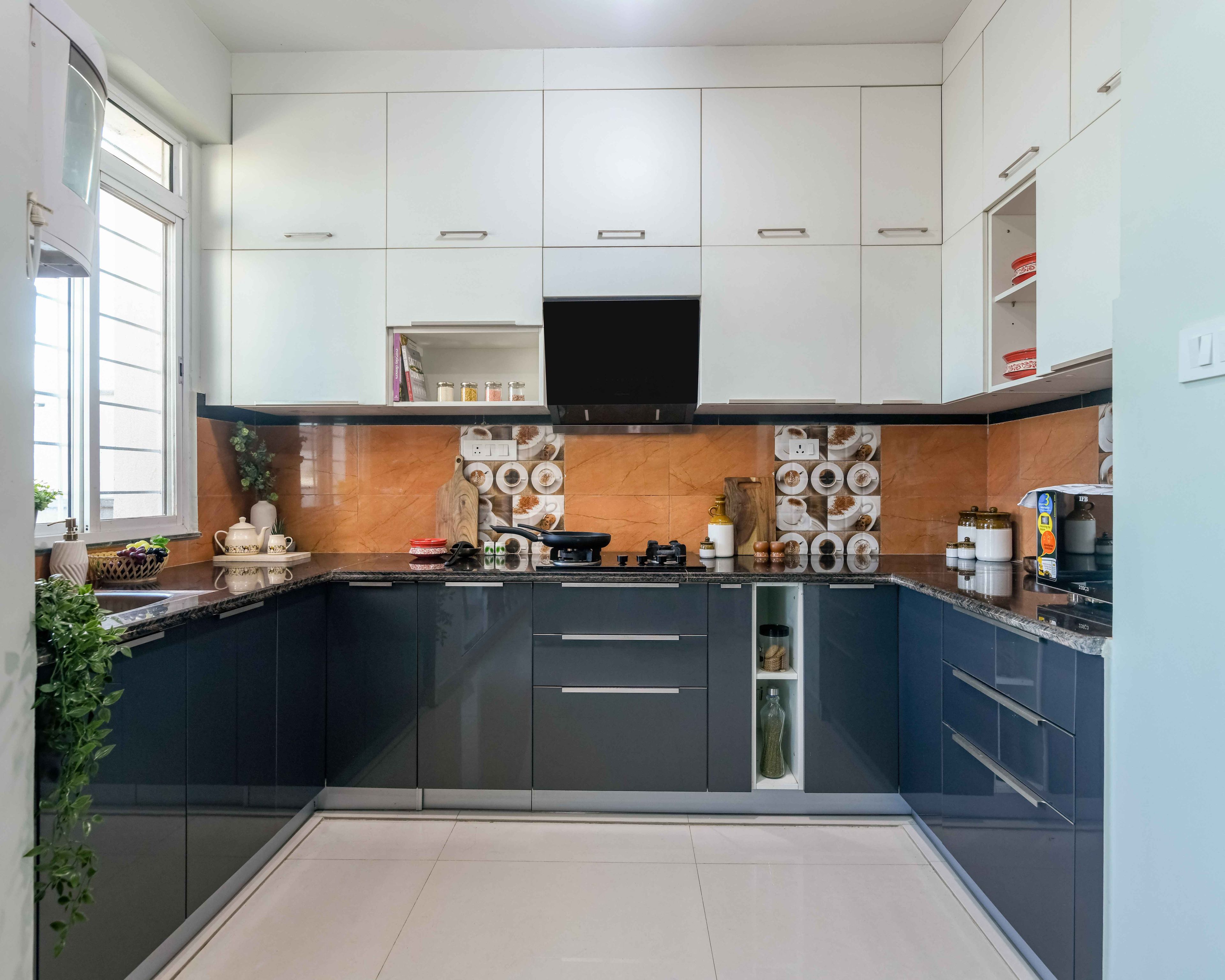 Modern dual tone kitchen with white and charcoal grey high gloss laminate, marble-look backsplash, and granite countertop in Bengaluru | Material Depot