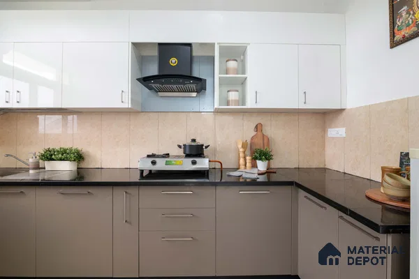 Modern dual tone kitchen with white and taupe laminate cabinets, black granite countertop, and beige wall tiles in Bengaluru | Material Depot