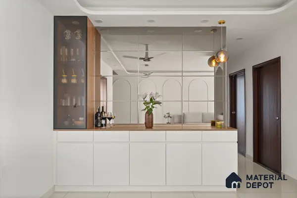 Modern Dining with white matte laminate cabinets, wooden countertop, and mirrored wall panels of 2 BHK in Purva Palm Beach Hennur Bengaluru | Material Depot