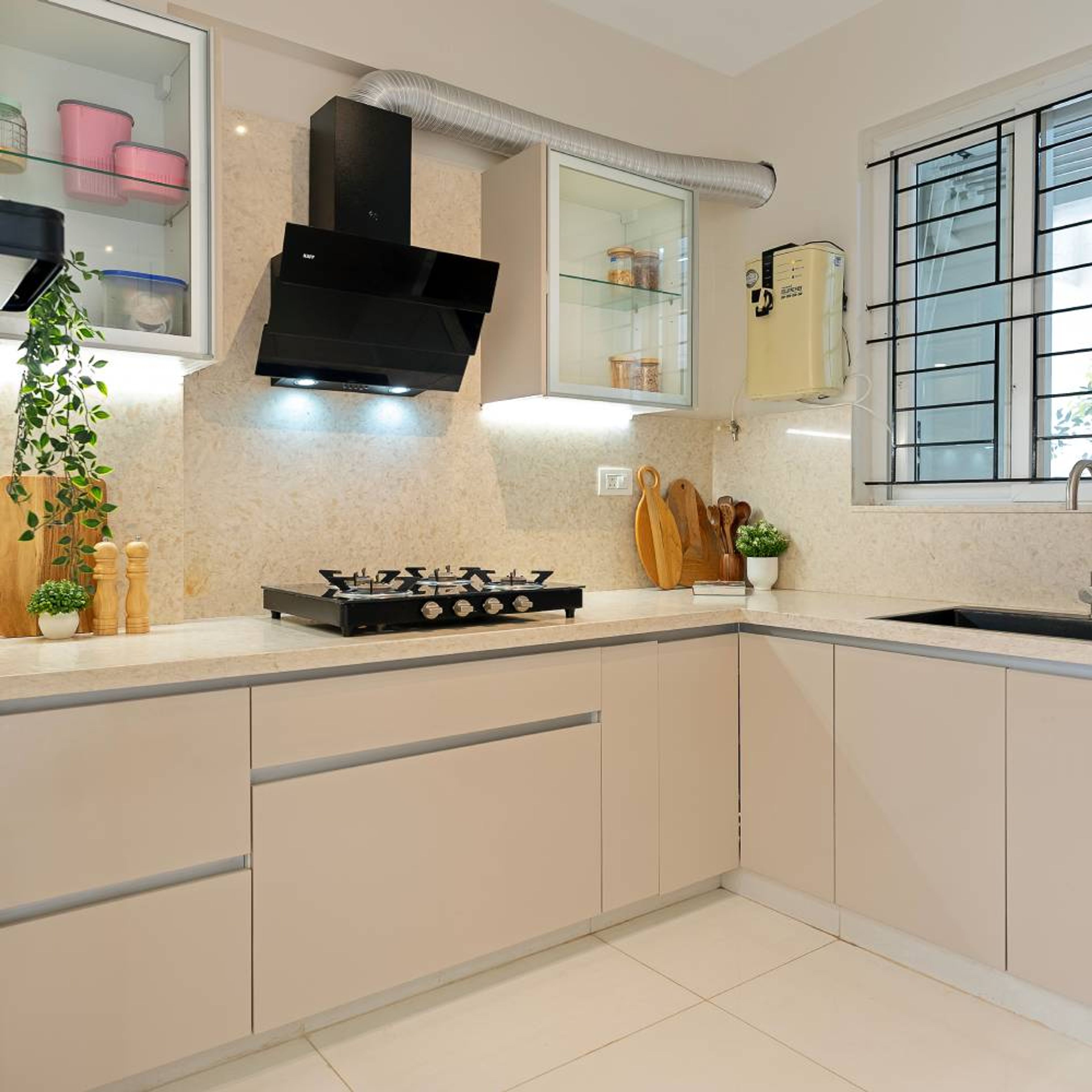 Modern kitchen with beige matte laminate cabinets and cream marble backsplash in Bengaluru | Material Depot