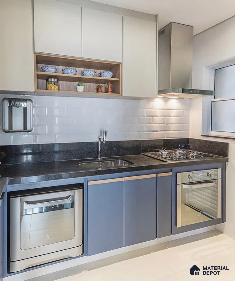 Modern kitchen with blue and beige laminate cabinets, black granite countertop, and white subway backsplash tiles in Bengaluru | Material Depot