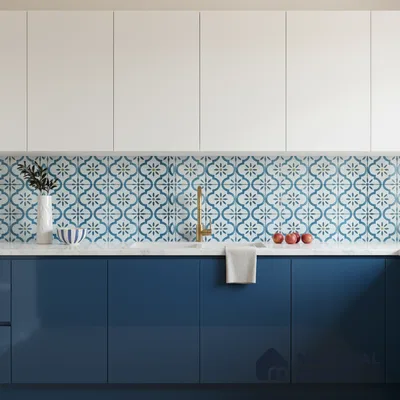 Modern kitchen with blue and white laminate, patterned blue moroccan backsplash tile, and white quartz countertop in Bengaluru