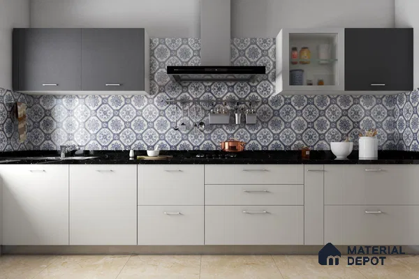 Modern kitchen with blue and white moroccan backsplash tiles, grey and white laminate cabinets, and black granite countertop in Bengaluru | Material Depot