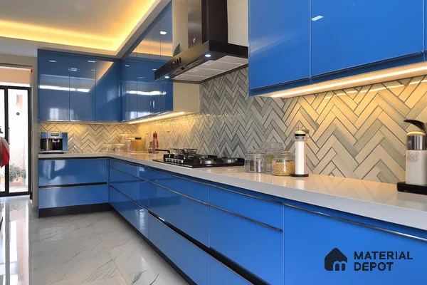 Modern kitchen with blue high gloss laminate cabinets, white quartz countertop, and herringbone subway tile backsplash in Bengaluru | Material Depot