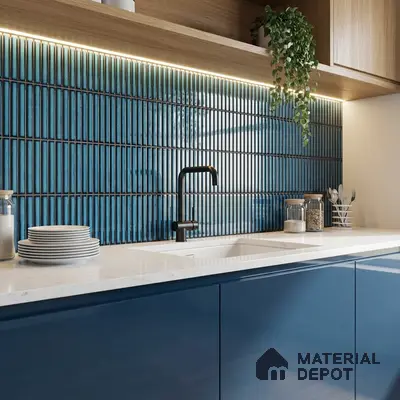 Modern kitchen with blue kitkat backsplash tile, navy blue high gloss laminate cabinets, and white quartz countertop