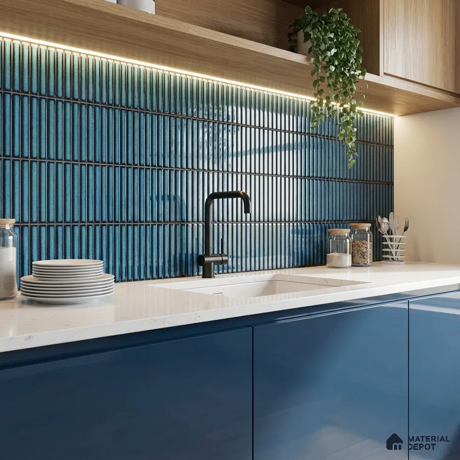 Modern kitchen with blue kitkat backsplash tile, navy blue high gloss laminate cabinets, and white quartz countertop