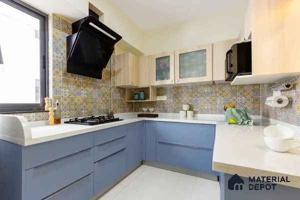 Modern kitchen with blue laminate cabinets, white quartz countertop, and yellow-blue patterned moroccan backsplash tiles in Bengaluru | Material Depot