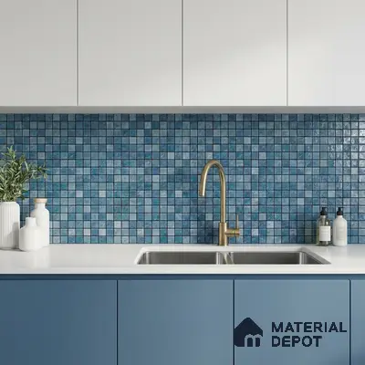 Modern kitchen with blue mosaic backsplash tile, white quartz countertop, and blue laminate cabinets