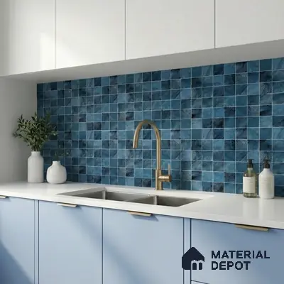 Modern kitchen with blue mosaic backsplash tile, white quartz countertop, and pastel blue laminate cabinets