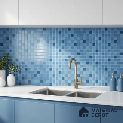 Modern kitchen with blue mosaic backsplash tiles, matte blue laminate cabinets, and white quartz countertop