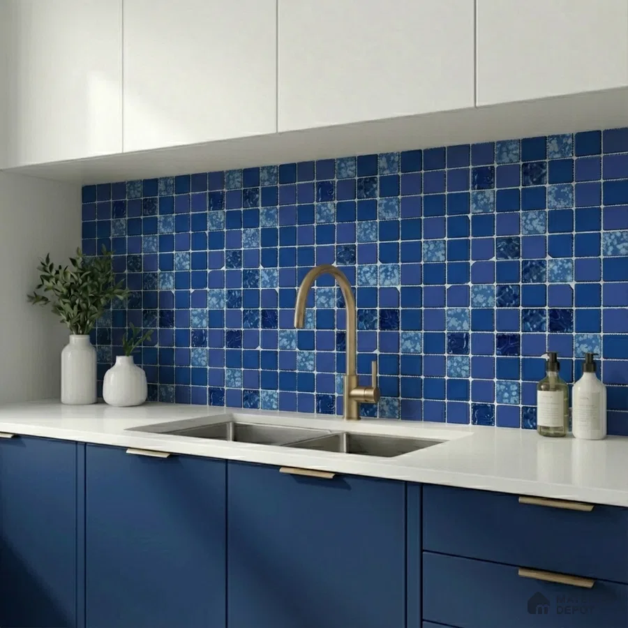 Modern kitchen with blue mosaic backsplash tiles, white quartz countertop, and navy blue laminate cabinets