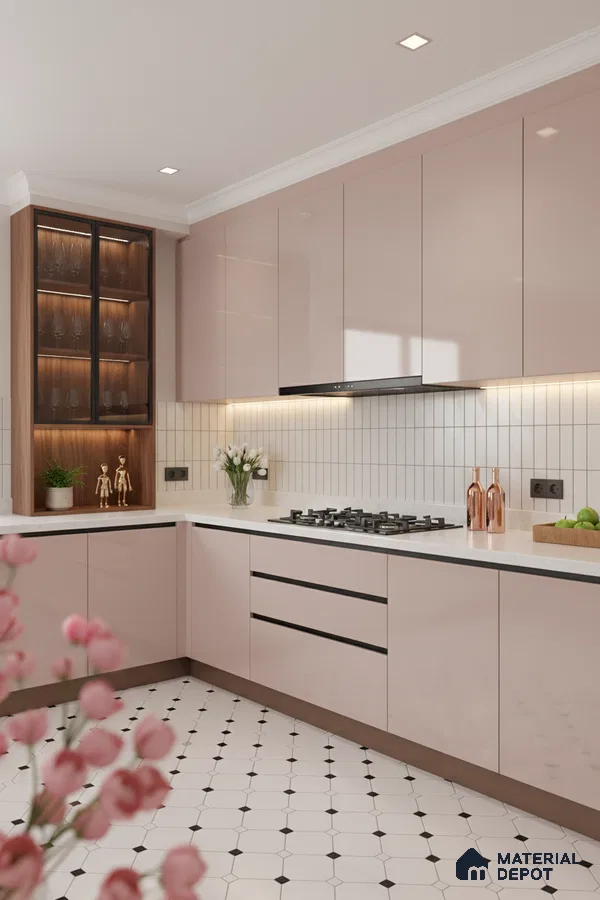Modern kitchen with blush pink high gloss laminate, white quartz countertop, and geometric patterned floor tiles in Bengaluru