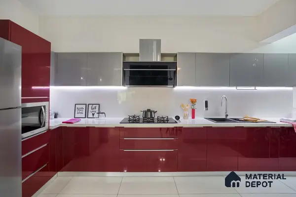 Modern kitchen with burgundy high gloss laminate, grey high gloss laminate, and white quartz countertop in Bengaluru | Material Depot