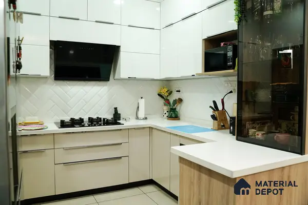 Modern kitchen with frosty white and beige laminate, white quartz countertop, and herringbone subway backsplash tile in Bengaluru | Material Depot