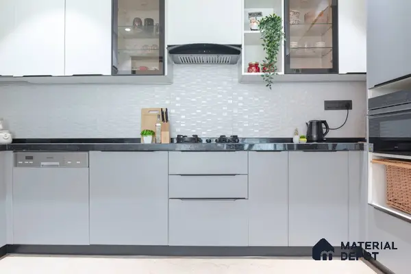 Modern kitchen with frosty white and light grey laminate, black granite countertop, and white textured backsplash tile in Bengaluru | Material Depot