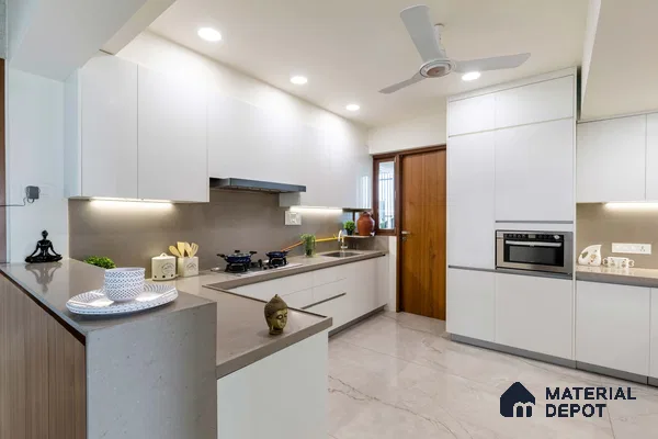 Modern kitchen with frosty white laminate cabinets, taupe quartz countertop, and marble-look floor tiles in Bengaluru | Material Depot