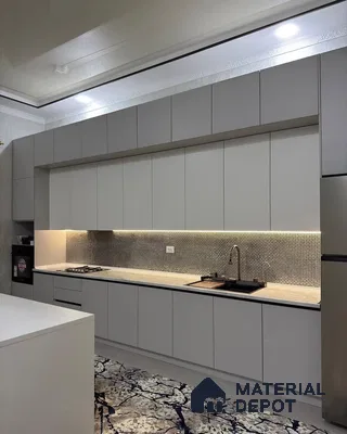 Modern kitchen with frosty white matte laminate cabinets, mosaic tile backsplash, and marble pattern floor tile in Bengaluru | Material Depot