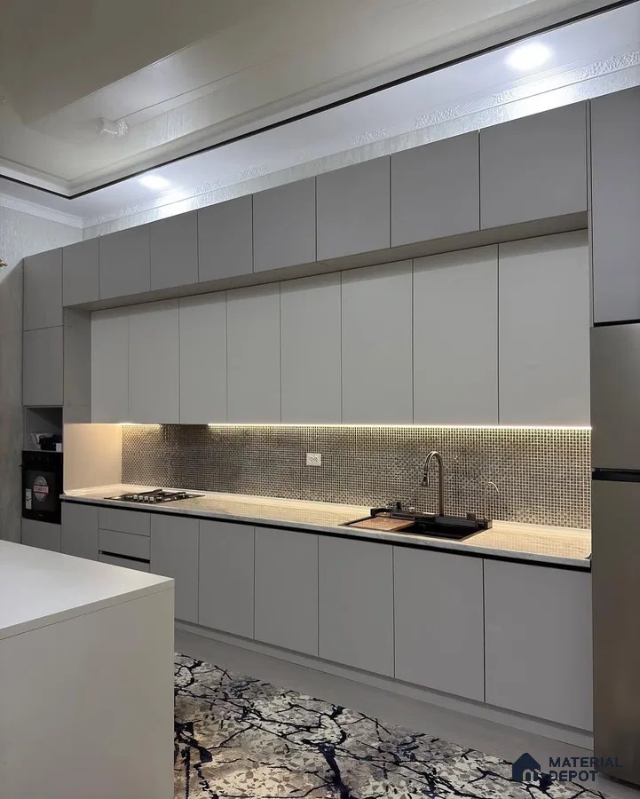 Modern kitchen with frosty white matte laminate cabinets, mosaic tile backsplash, and marble pattern floor tile in Bengaluru | Material Depot