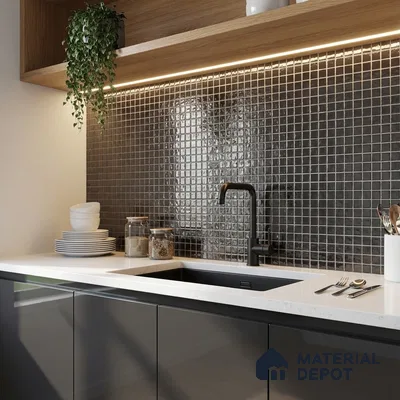 Modern kitchen with glossy grey laminate cabinets, white quartz countertop, and black mosaic backsplash tiles