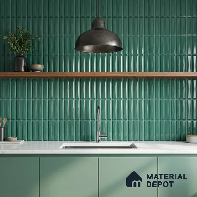 Modern kitchen with green kitkat wall tiles, pastel green laminate cabinets, and white quartz countertop