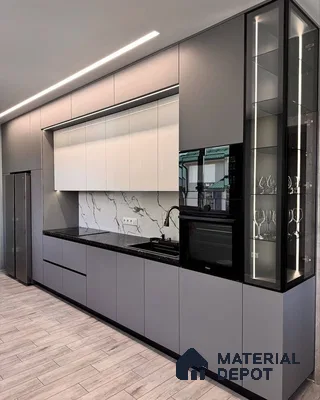 Modern kitchen with grey and white laminate cabinets, black granite countertop, and marble-look backsplash in Bengaluru | Material Depot