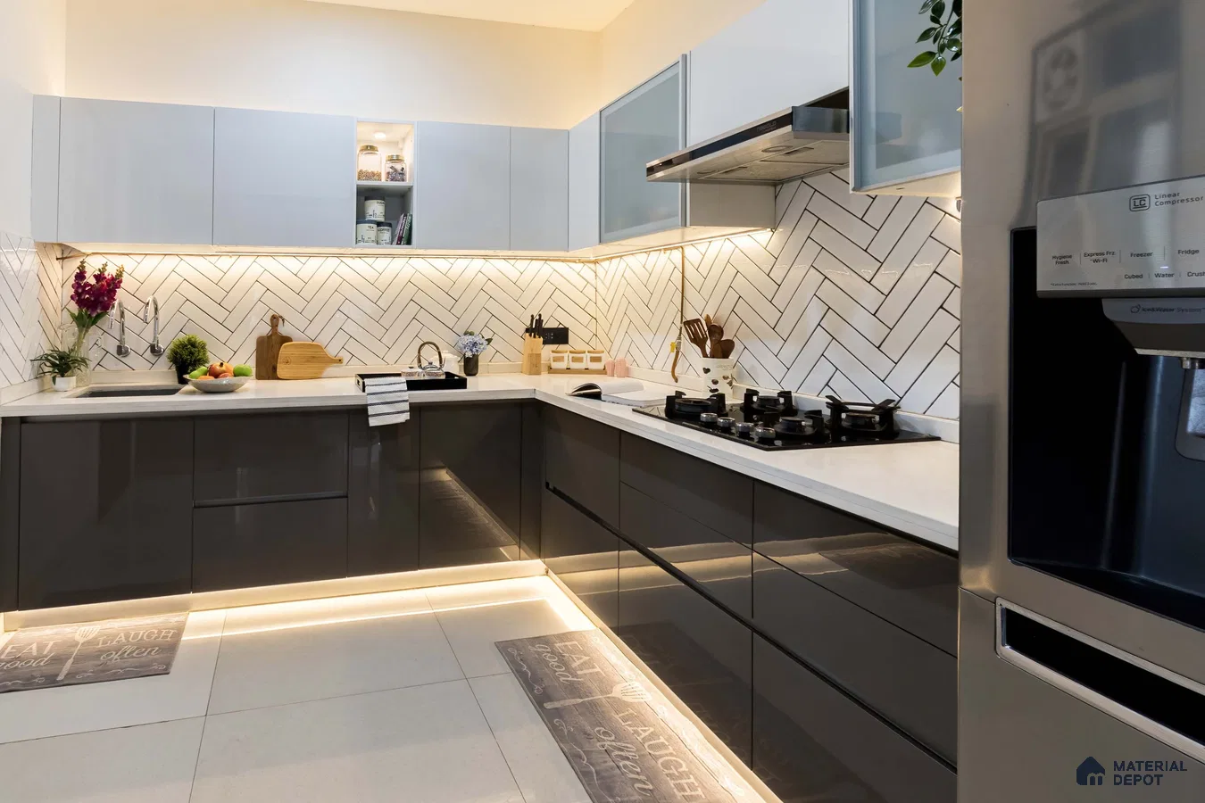 Modern kitchen with grey high gloss laminate, white quartz countertop, and herringbone subway backsplash tile in Bengaluru | Material Depot