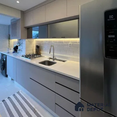 Modern kitchen with grey matte laminate cabinets, white quartz countertop, and white subway backsplash tiles in Bengaluru | Material Depot